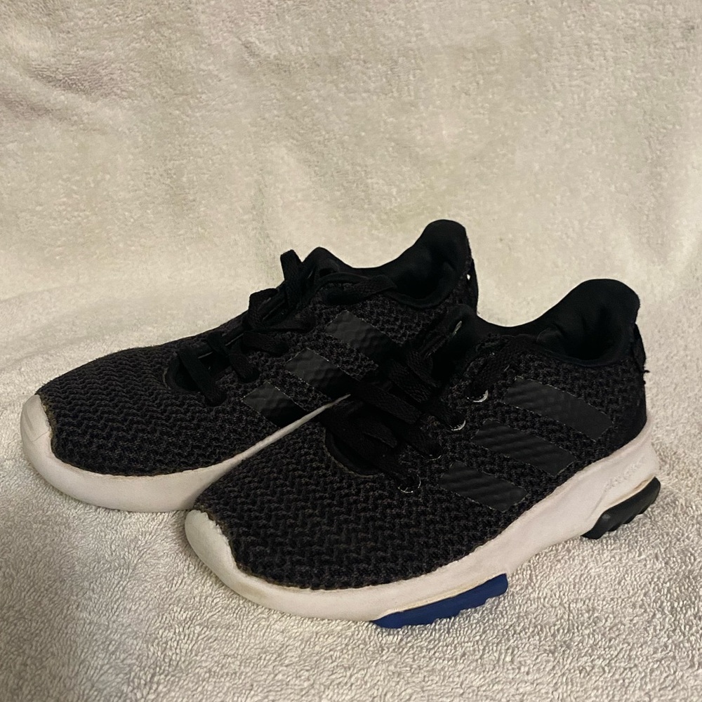 Adidas boys 12k black shoe with white bottom.